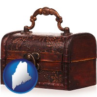 maine map icon and an antique wooden chest