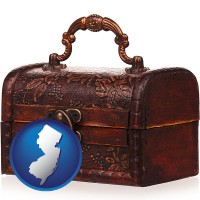 new-jersey map icon and an antique wooden chest