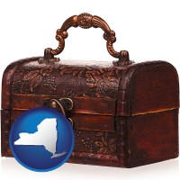 new-york map icon and an antique wooden chest