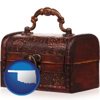 oklahoma map icon and an antique wooden chest